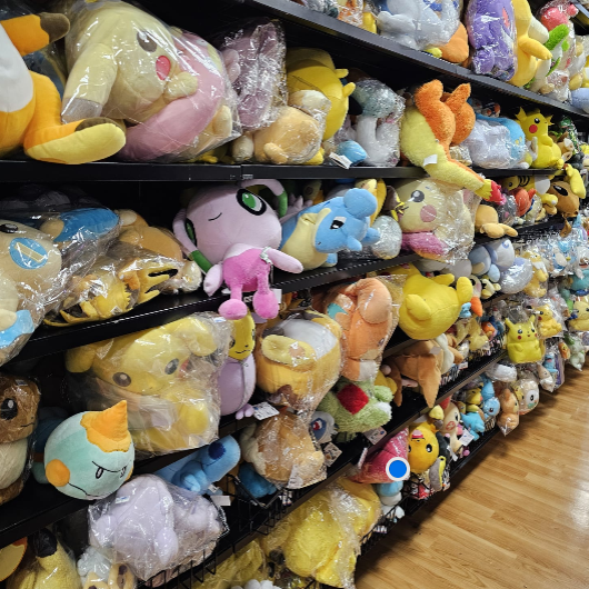 Pokemon Toys in Japan A display of various Pokémon plush toys on shelves.